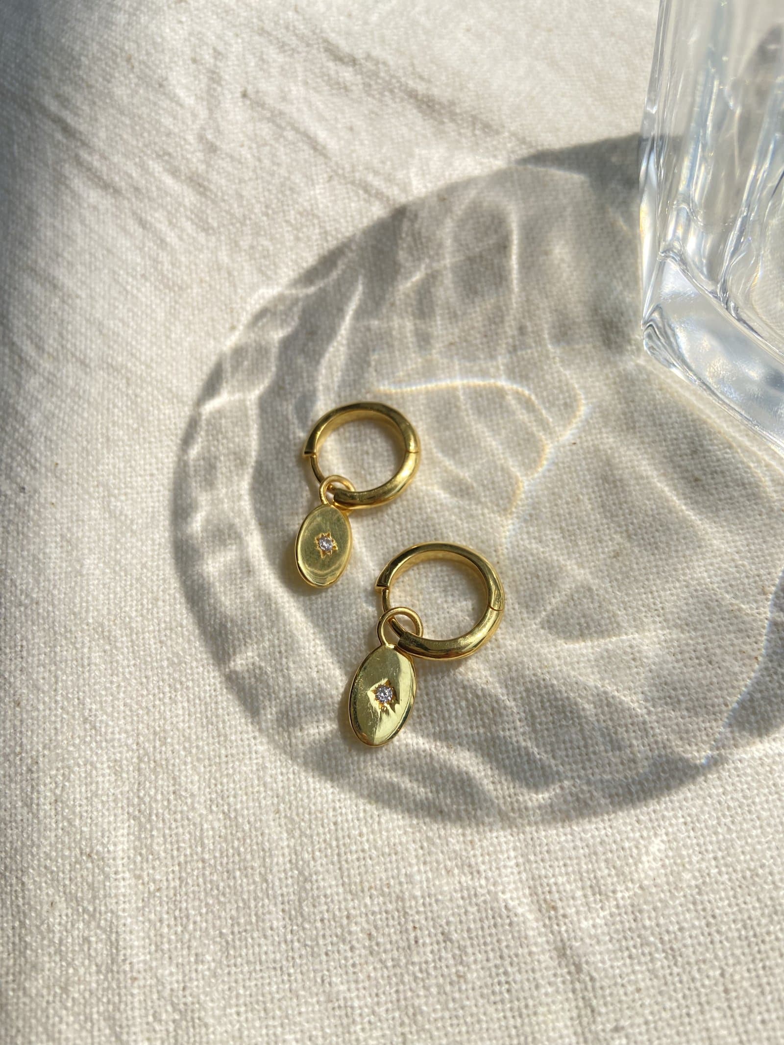 NIU gold hoop earrings styled for an ear party
